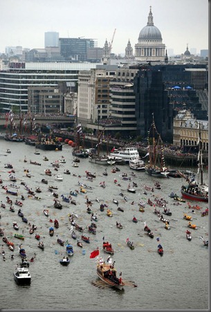 Rowing boats begin to gather on the River Thames, London, during the Diamond Jubilee river pageant